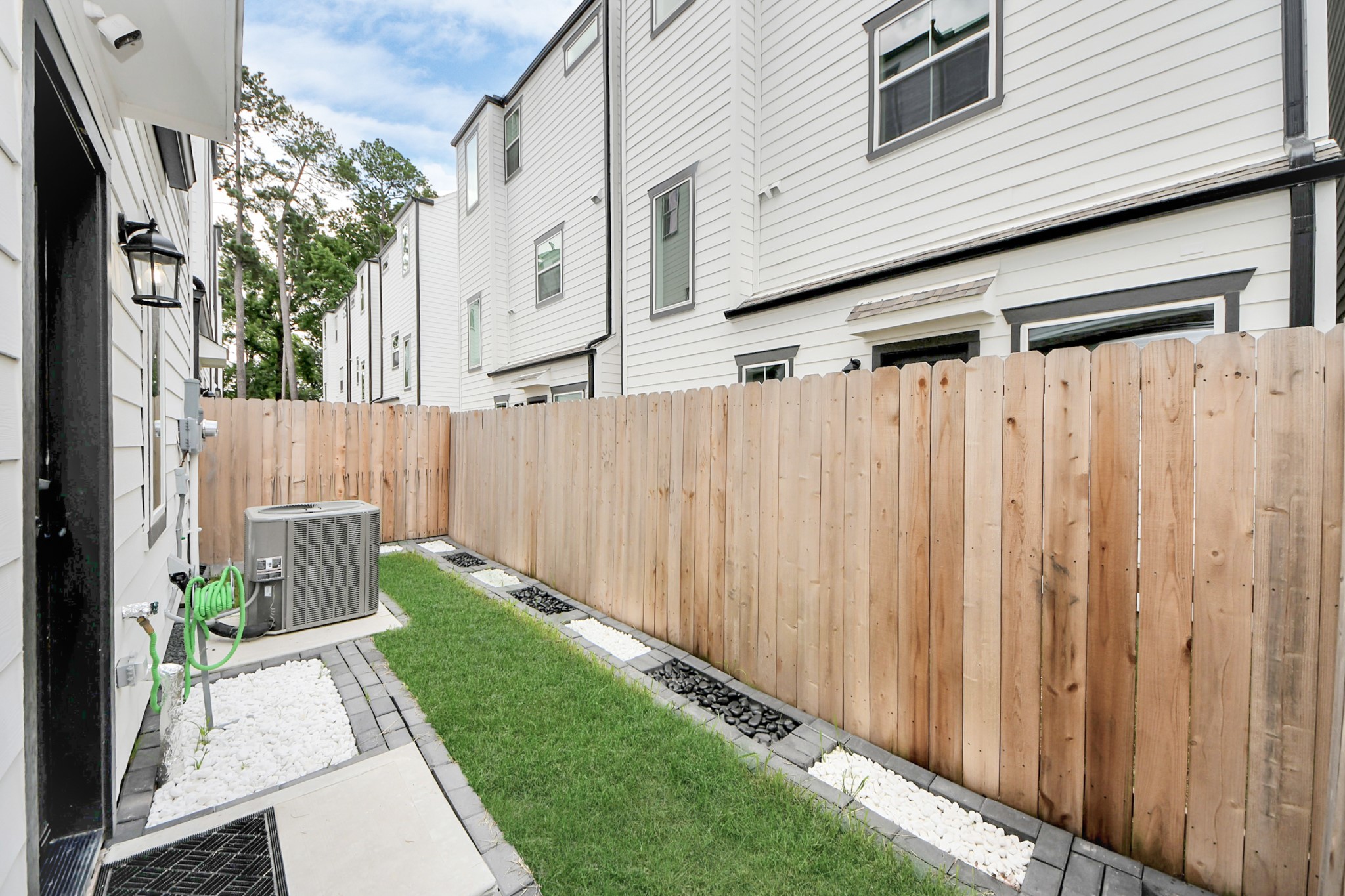 5502 Wheatley Street, Unit B Houston, TX 77091 - Photo 31 of 35 a view of a back yard of a house with a garden