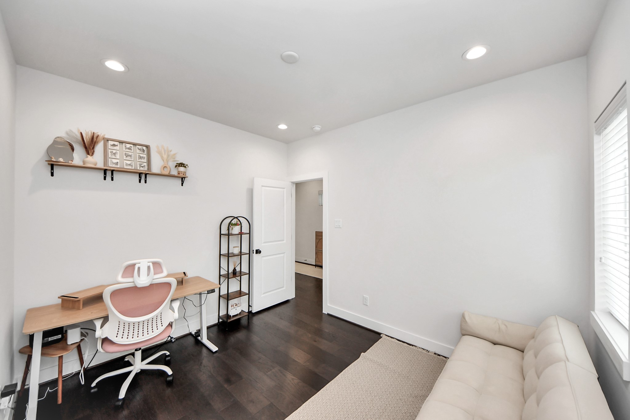 5502 Wheatley Street, Unit B Houston, TX 77091 - Photo 4 of 35 a view of a room with furniture and wooden floor