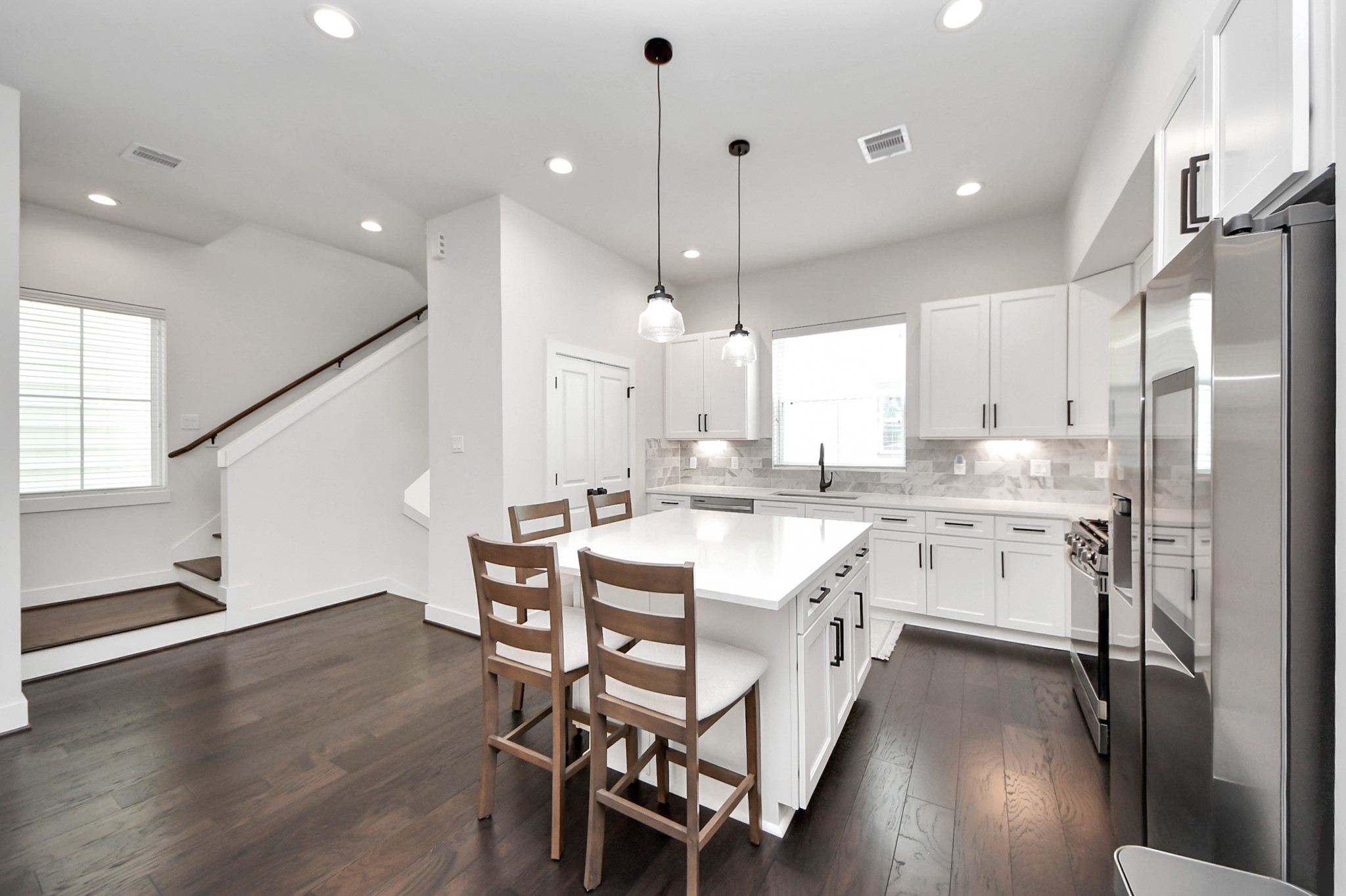 5502 Wheatley Street, Unit B Houston, TX 77091 - Photo 9 of 35 a large kitchen with a table and chairs