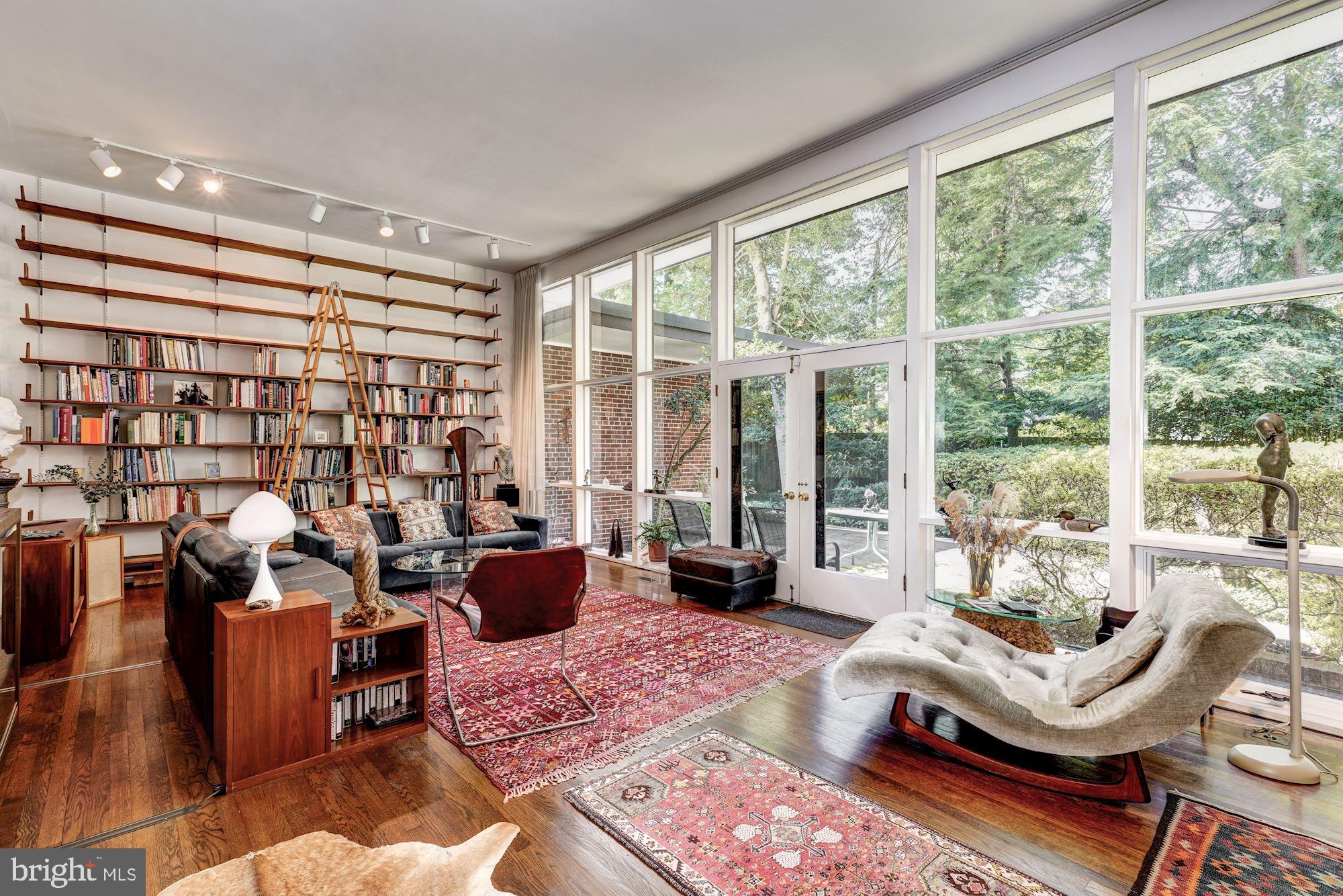 3721 Huntington Street Northwest Washington, DC 20015 - Photo 4 of 30 Living room with wall of windows and garden access