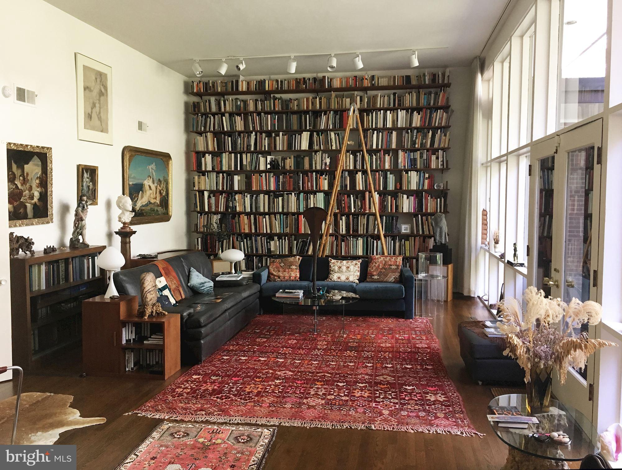 3721 Huntington Street Northwest Washington, DC 20015 - Photo 5 of 30 Living room with floor to ceiling bookcases