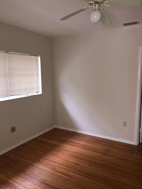 701 Southwest 20th Road, Unit A Miami, FL 33129 - Photo 2 of 4 a view of a room with wooden floor and fan