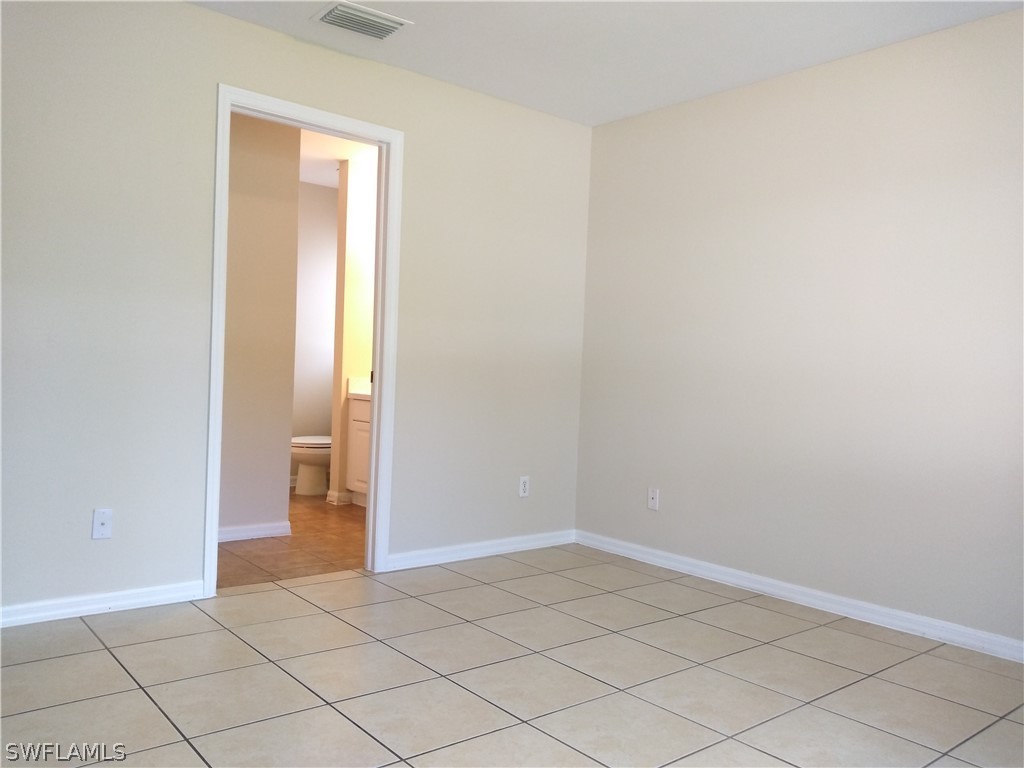 2213 Wilson Road Lehigh Acres, FL 33973 - Photo 11 of 14 a view of an empty room and closet area