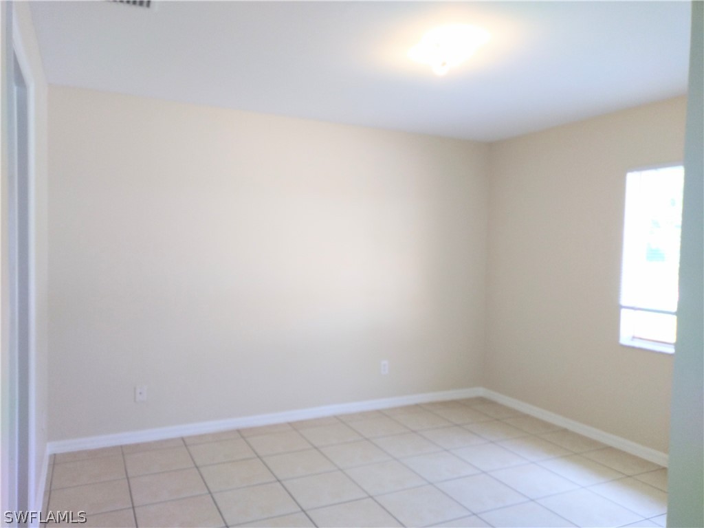 2213 Wilson Road Lehigh Acres, FL 33973 - Photo 12 of 14 a view of an empty room