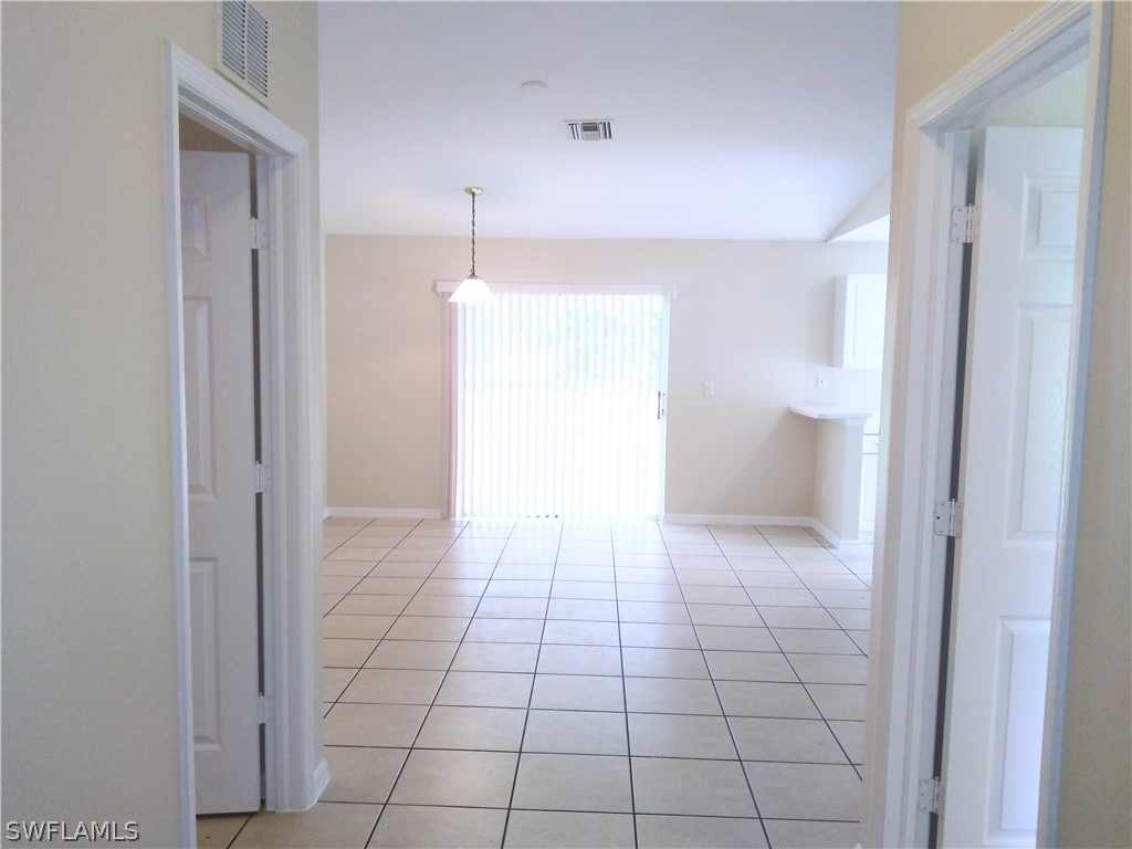 2213 Wilson Road Lehigh Acres, FL 33973 - Photo 4 of 14 a view of an empty room and a bathroom