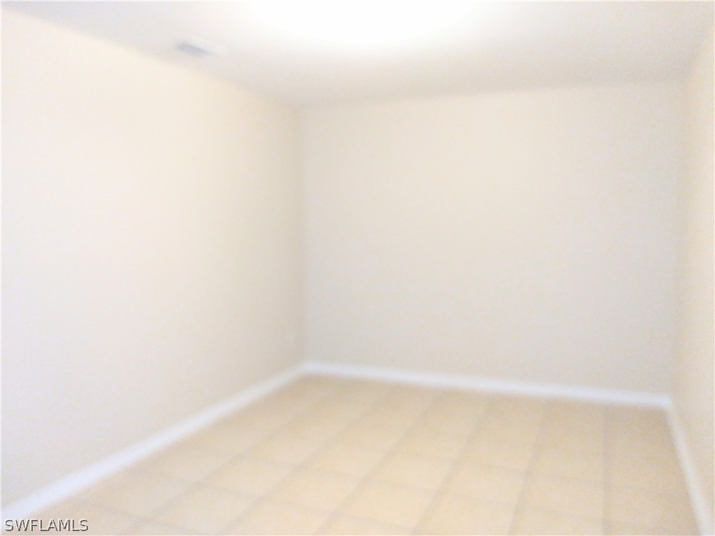 2213 Wilson Road Lehigh Acres, FL 33973 - Photo 7 of 14 a small space with a window