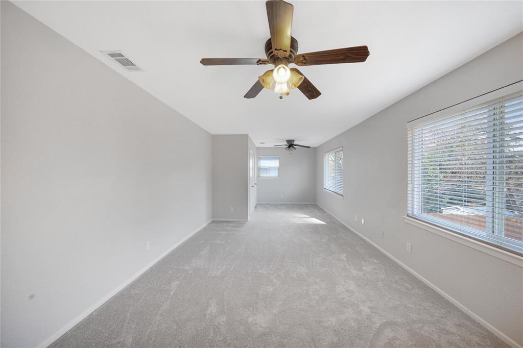 9227 Pinewood Drive Dallas, TX 75243 - Photo 15 of 27 a view of an empty room with a window