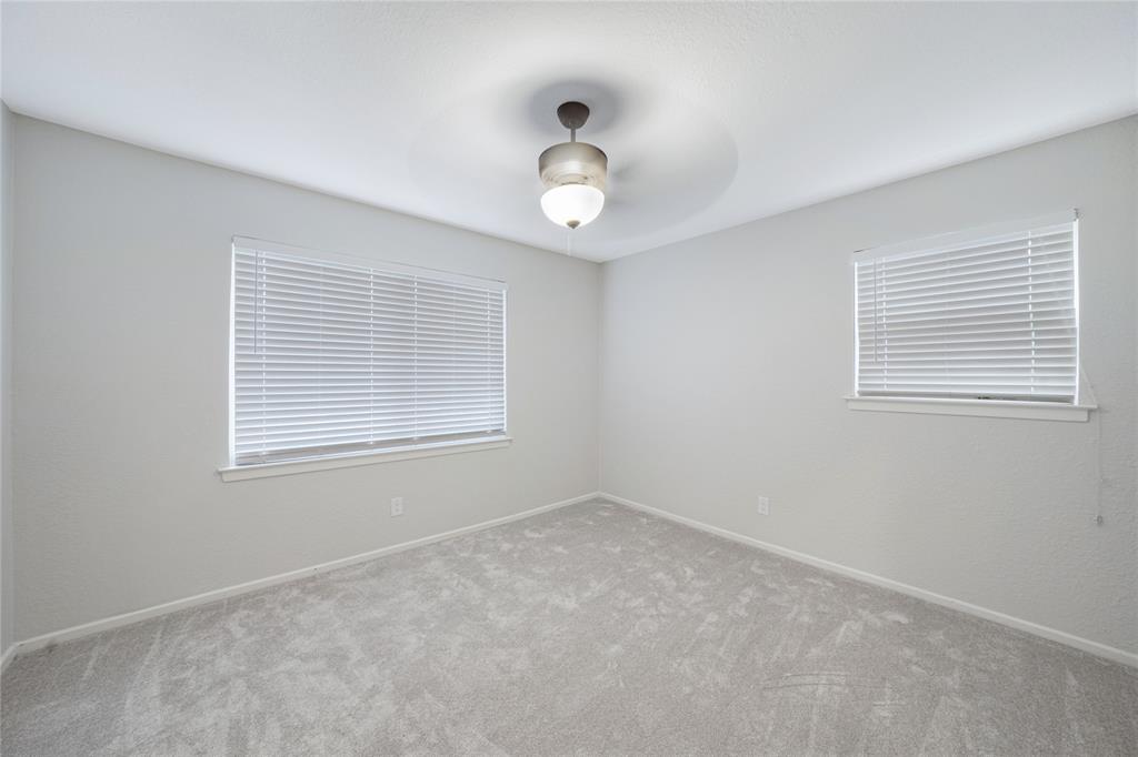 9227 Pinewood Drive Dallas, TX 75243 - Photo 18 of 27 a view of an empty room with a window