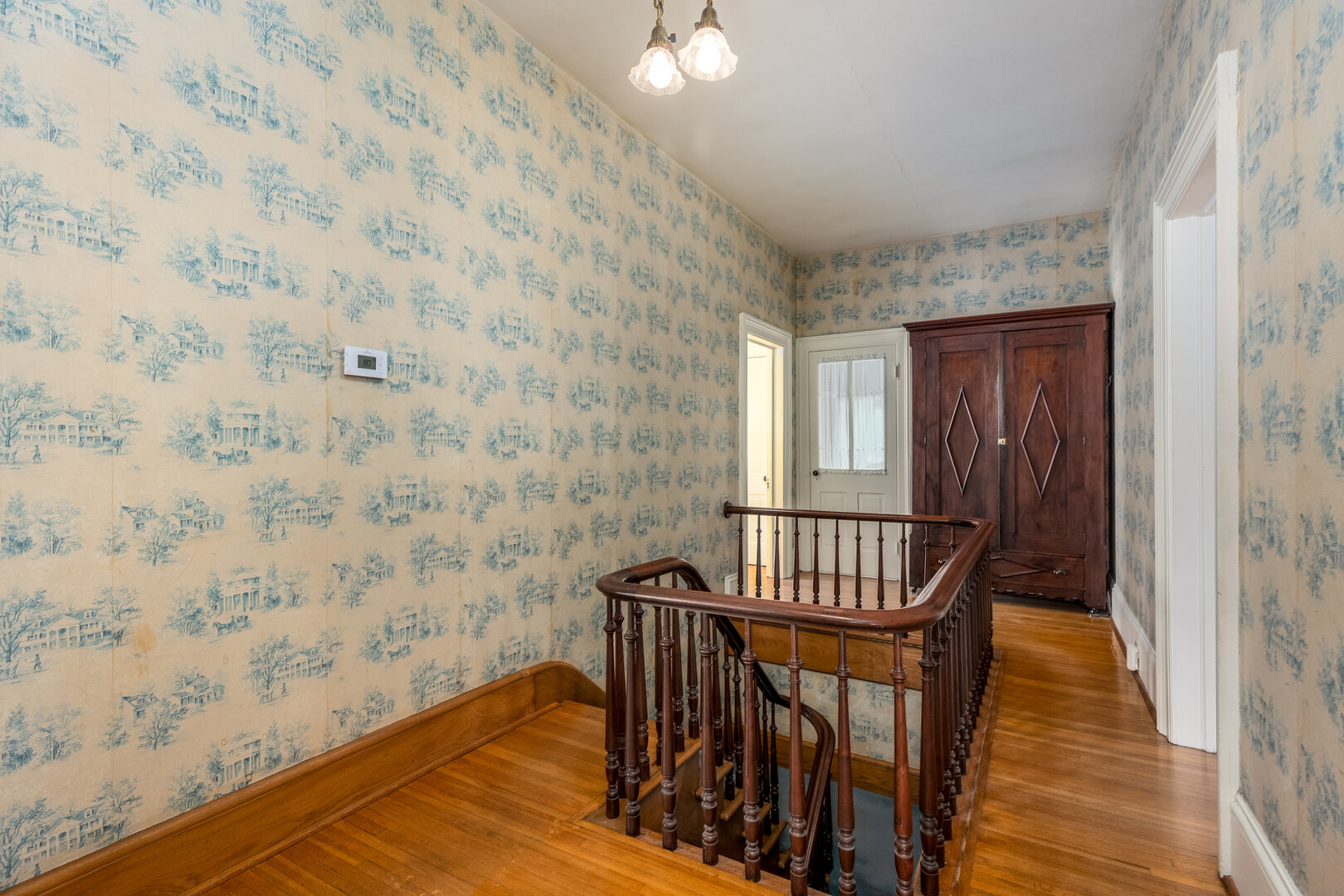 326 Congress Street Ottawa, IL 61350 - Photo 16 of 40 a view of a hallway with wooden floor and windows
