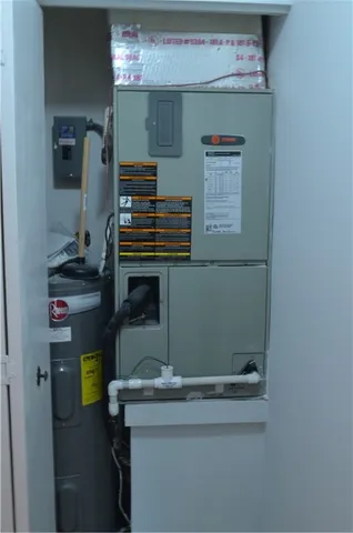 a view of a small space with wooden floor and a window