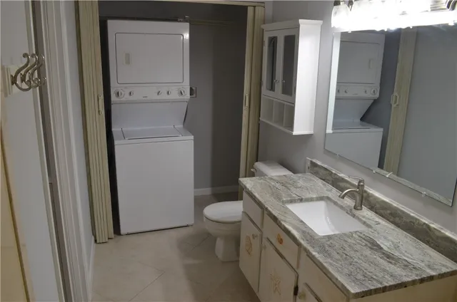 a view of wooden floor and windows in a room