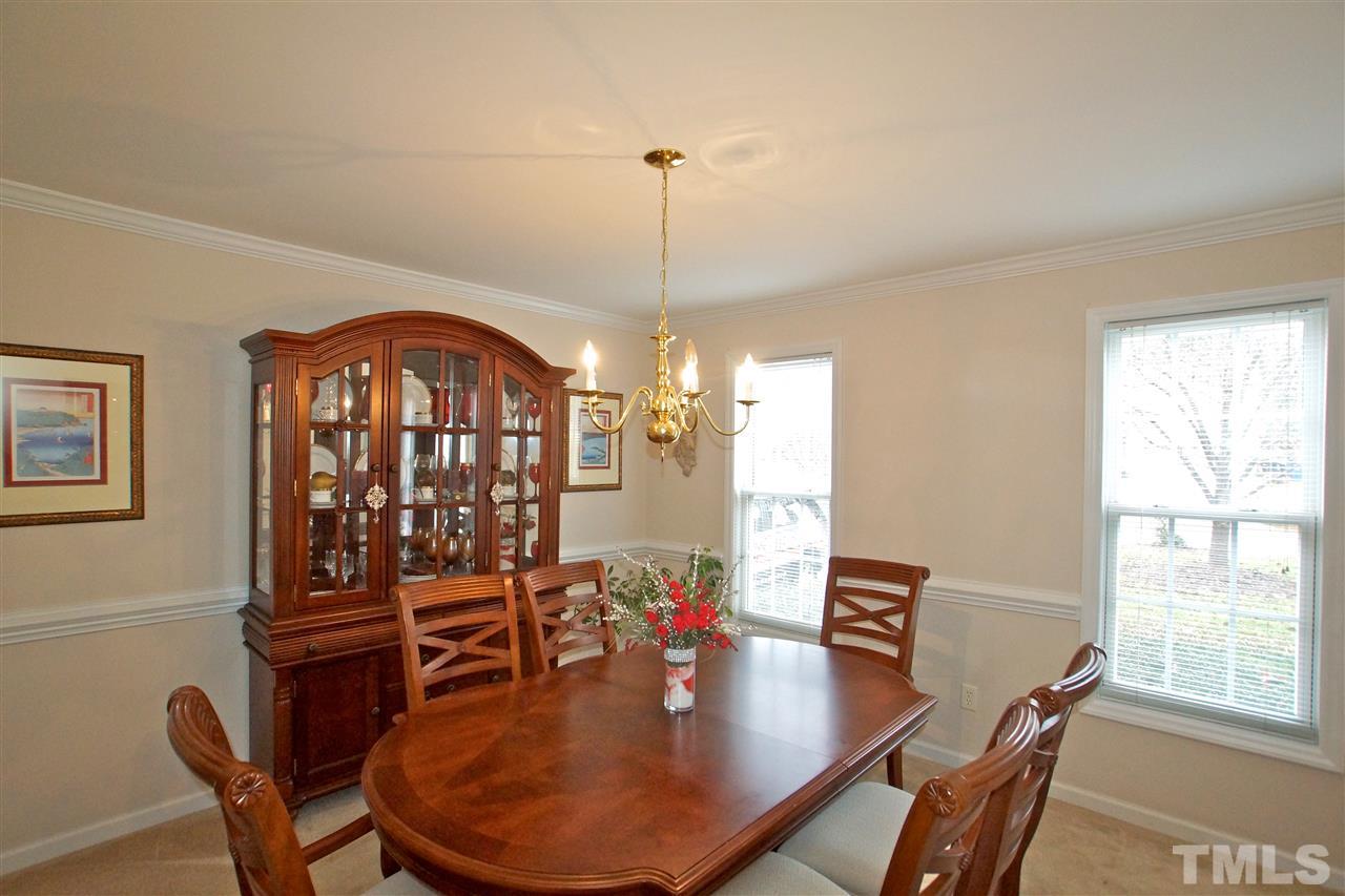 724 Windcrest Road Durham, NC 27713 - Photo 9 of 24 Large dining area with chair rail molding.
