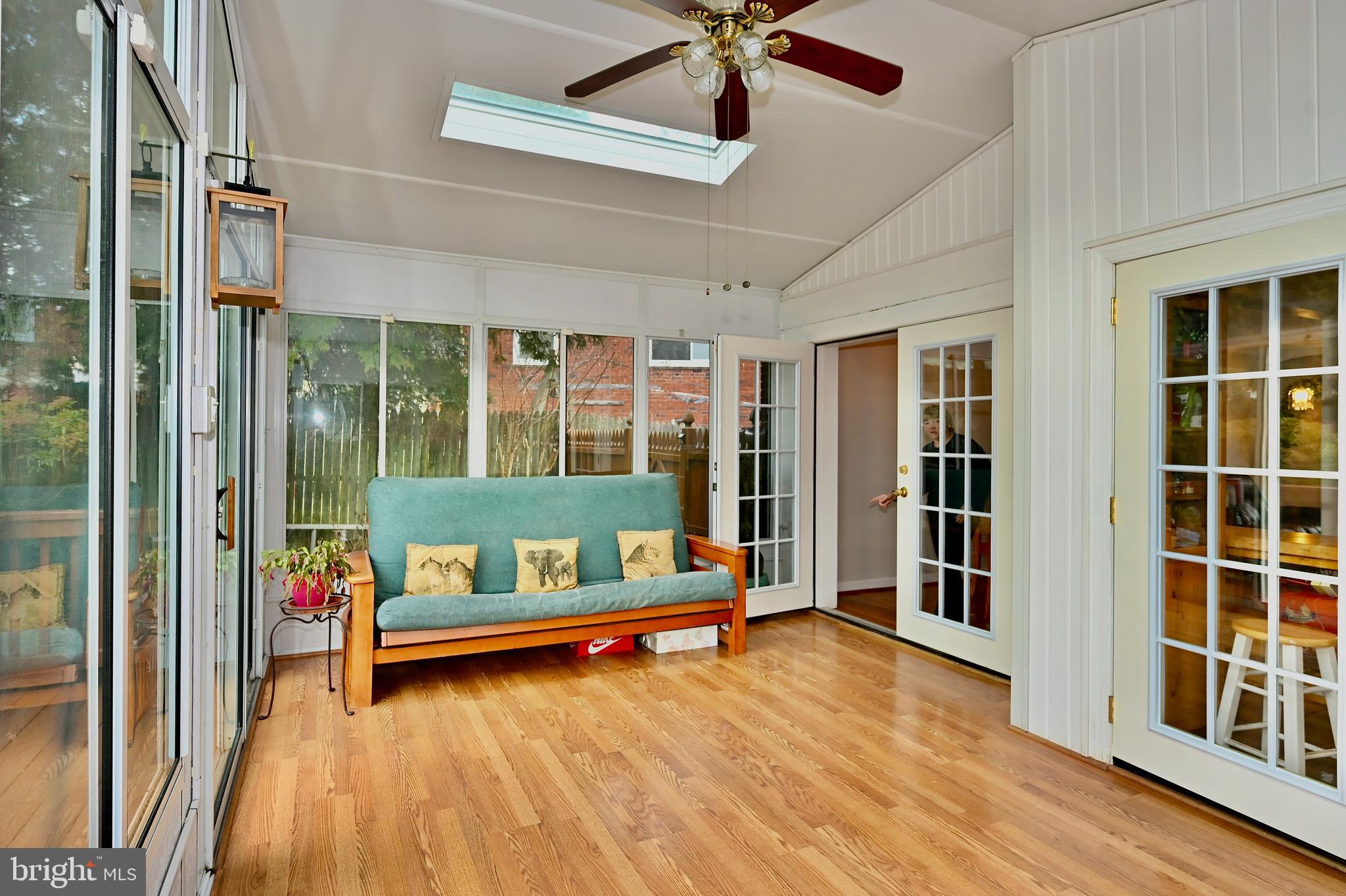 3308 Kayson Street Silver Spring, MD 20906 - Photo 14 of 30 Sunroom with hardwood floor and skylights