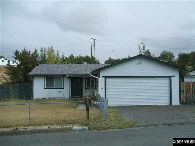 14080 Perlite Drive Reno, NV 89521 - Photo 1 of 1 a front view of a house with a yard and garage