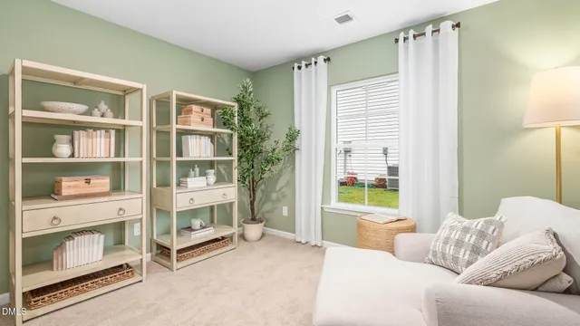 a bedroom with furniture and a window
