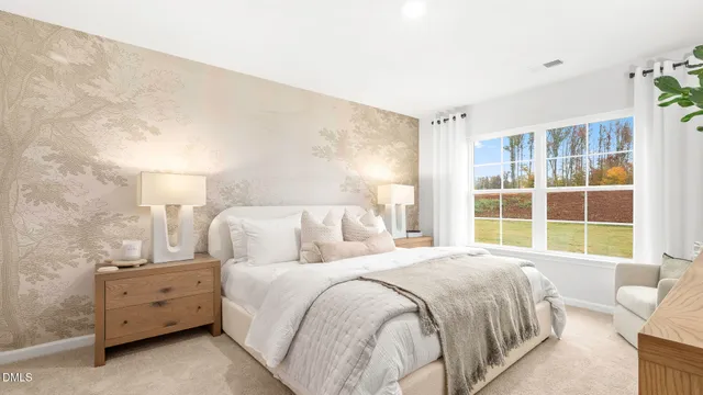 a spacious bedroom with a bed and a large window