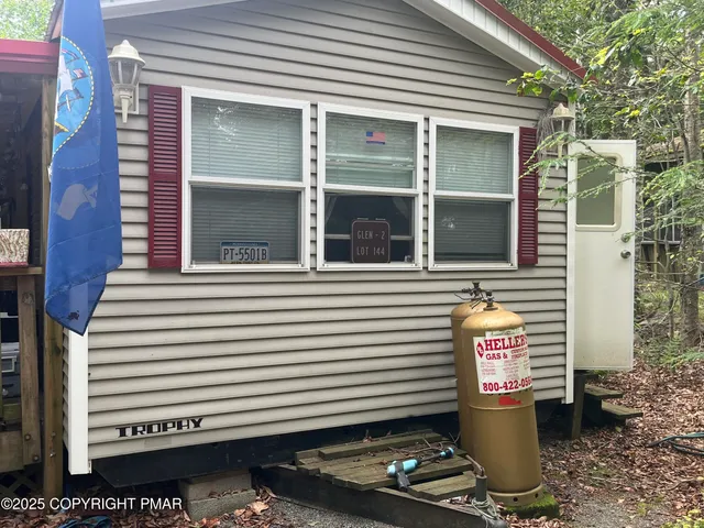 a kitchen with stainless steel appliances granite countertop a refrigerator and a stove