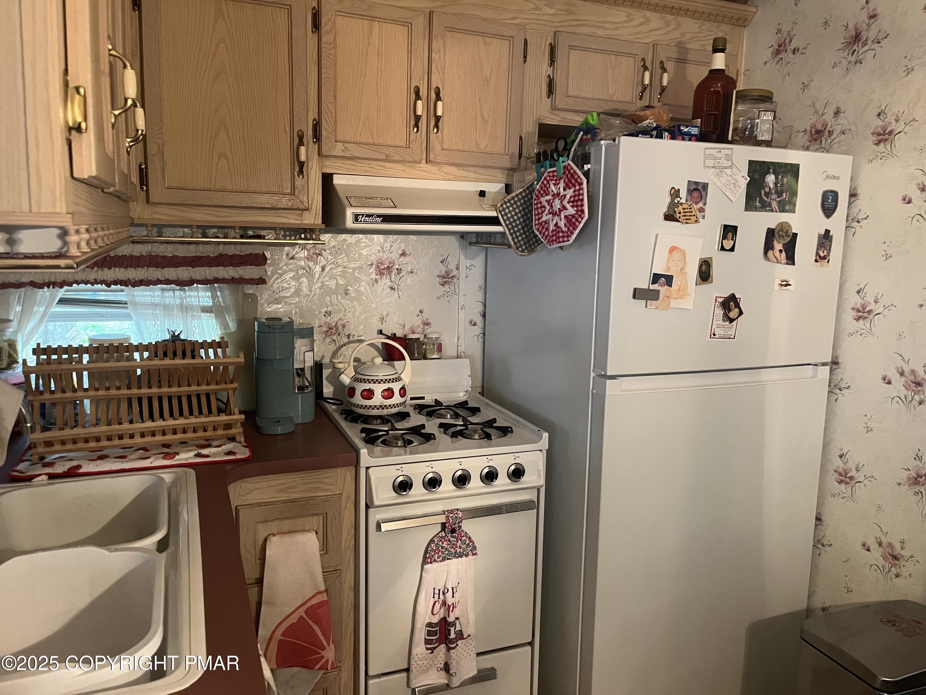 19 Menoken Trail Newfoundland, PA 18445 - Photo 5 of 12 a kitchen with stainless steel appliances granite countertop a refrigerator and a stove