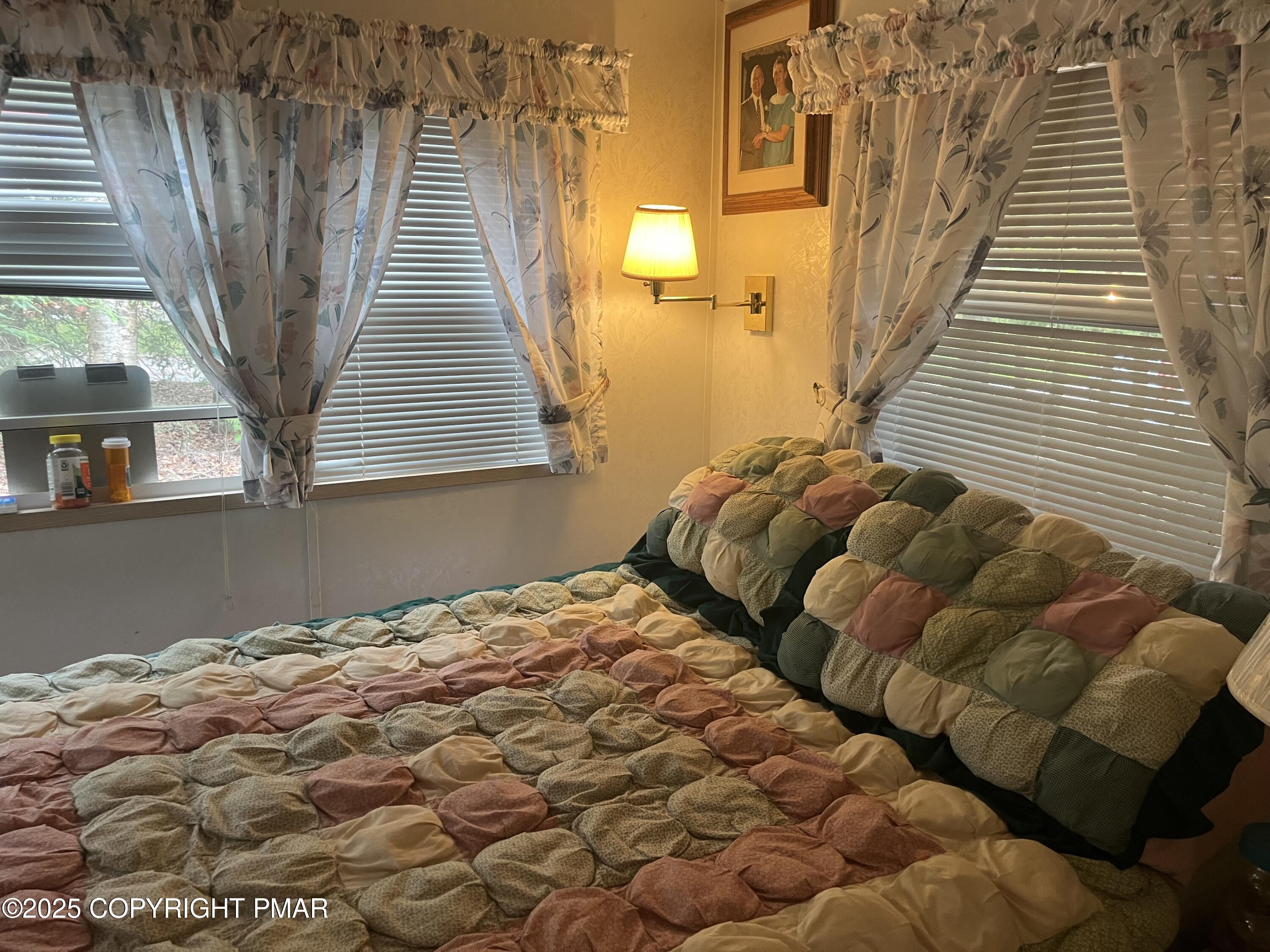 19 Menoken Trail Newfoundland, PA 18445 - Photo 7 of 12 a bedroom with a bed and a window