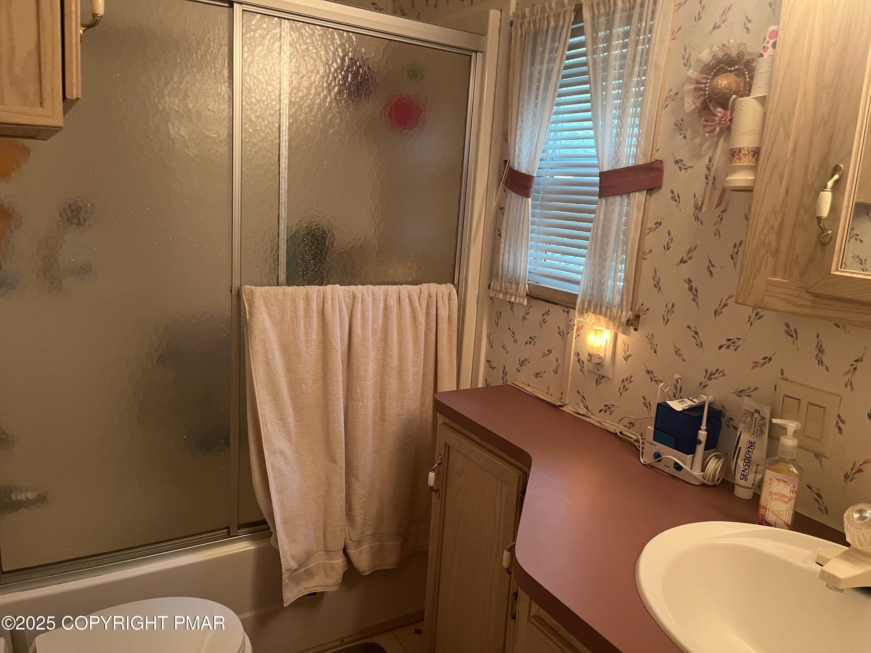 19 Menoken Trail Newfoundland, PA 18445 - Photo 9 of 12 a bathroom with a sink and a mirror
