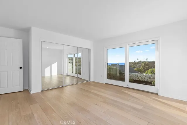 a bathroom with a double vanity sink mirror and glass door