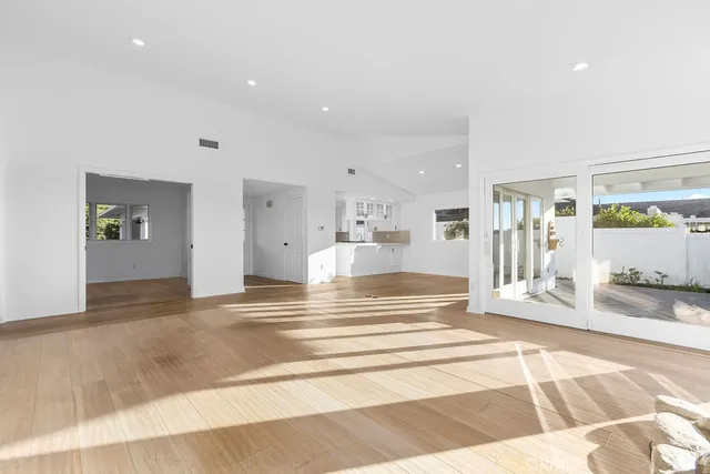 a view of a livingroom with a fireplace and window