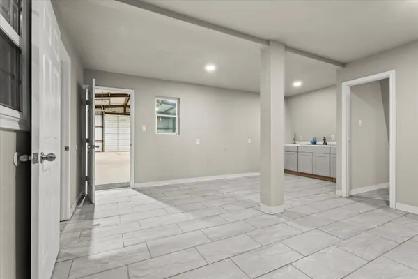 a view of a big room with closet and windows