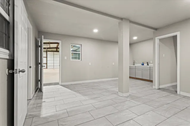 a view of a big room with closet and windows