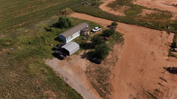 an aerial view of house with yard