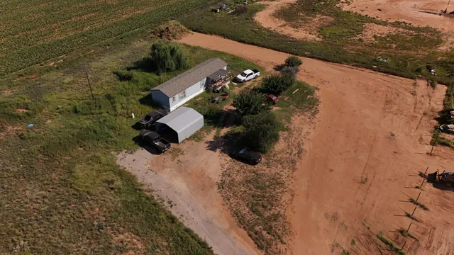 an aerial view of house with yard