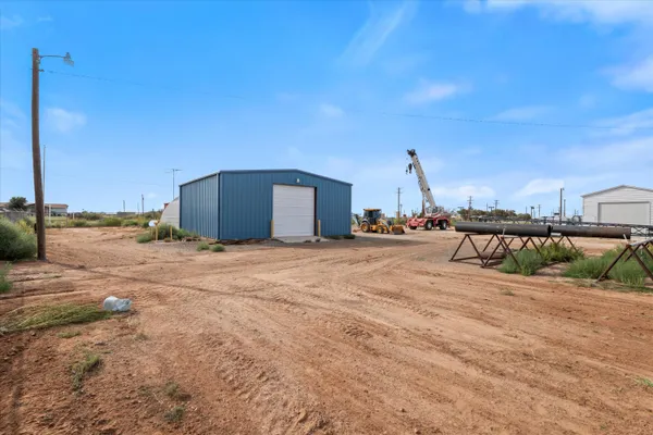 a view of a house with backyard and porch