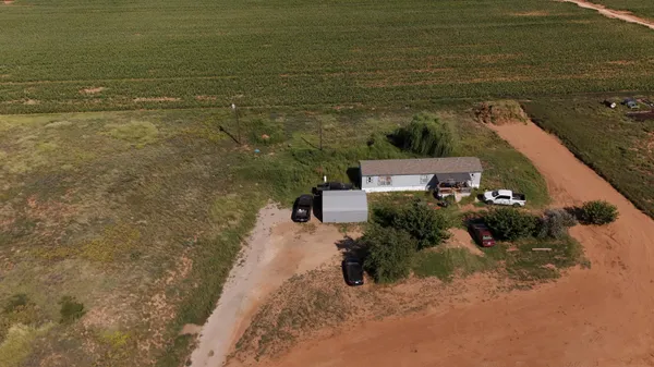 a view of a lake with a yard