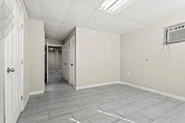 a view of a hallway with wooden shelves