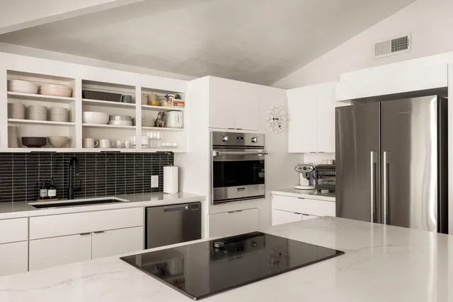 a view of room with furniture and wooden floor