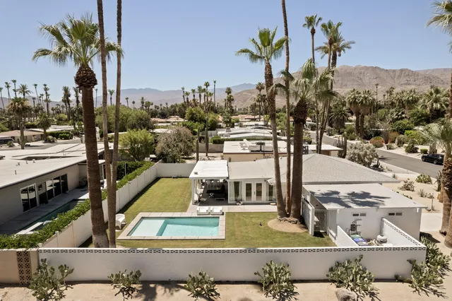a view of living room kitchen with furniture and flat screen tv