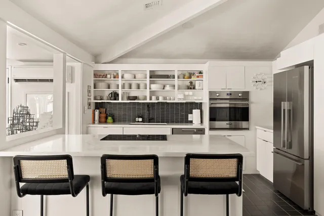 a view of a porch with furniture and a yard