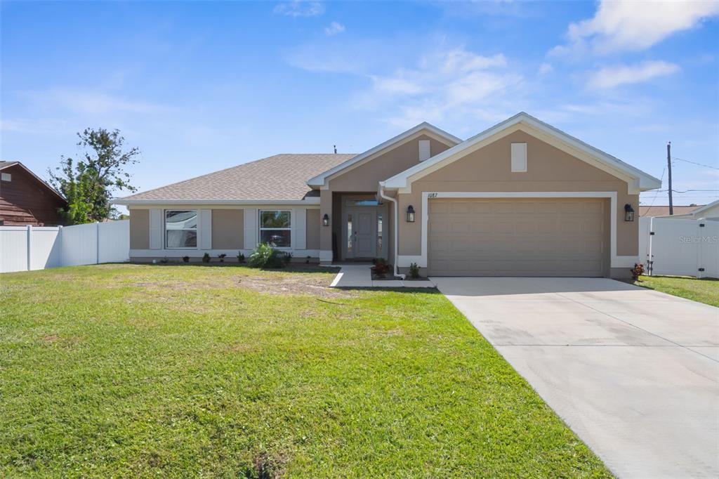 1087 Piedmont Road Venice, FL 34293 - Photo 1 of 1 a front view of a house with yard