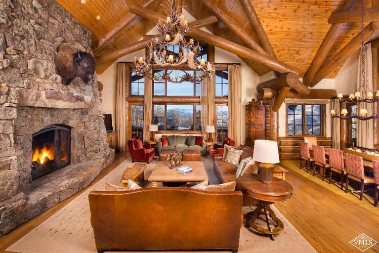 1888 Daybreak Ridge Road Avon, CO 81620 - Photo 5 of 25 a living room with furniture a fireplace and a large window