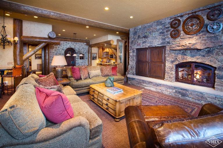 1888 Daybreak Ridge Road Avon, CO 81620 - Photo 8 of 25 a living room with furniture and a fireplace