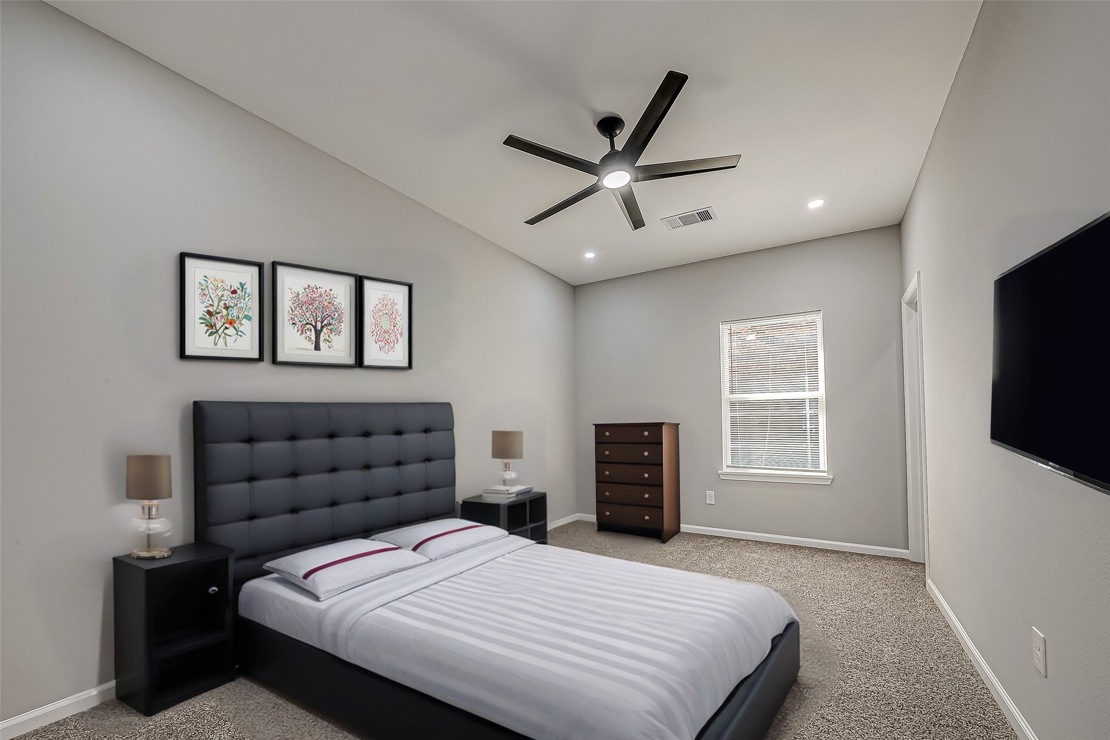 7234 St Augustine Street, Unit A Houston, TX 77021 - Photo 15 of 20 a bedroom with a bed and a flat screen tv