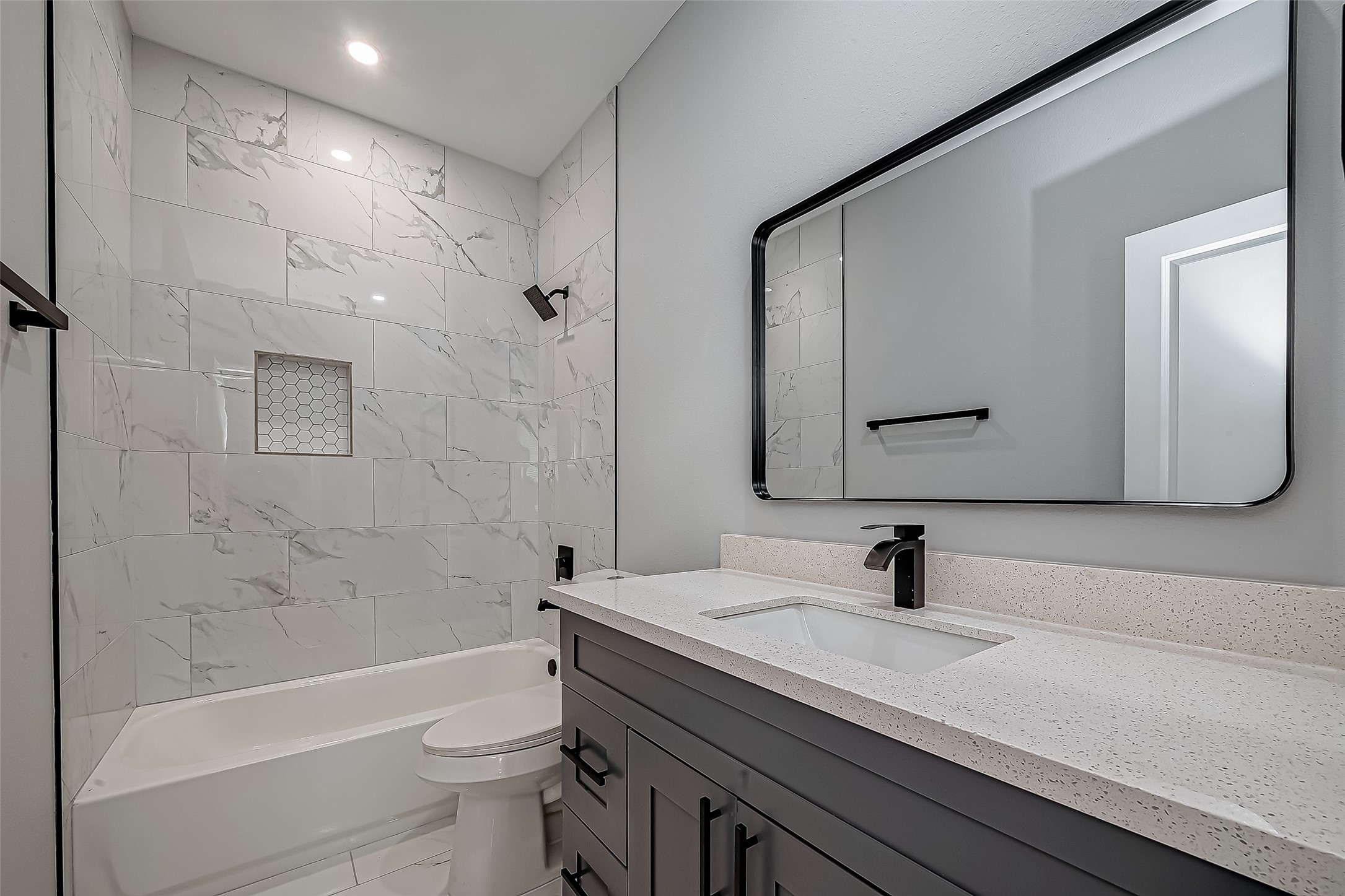 7234 St Augustine Street, Unit A Houston, TX 77021 - Photo 17 of 20 a bathroom with a sink a toilet and a bathtub
