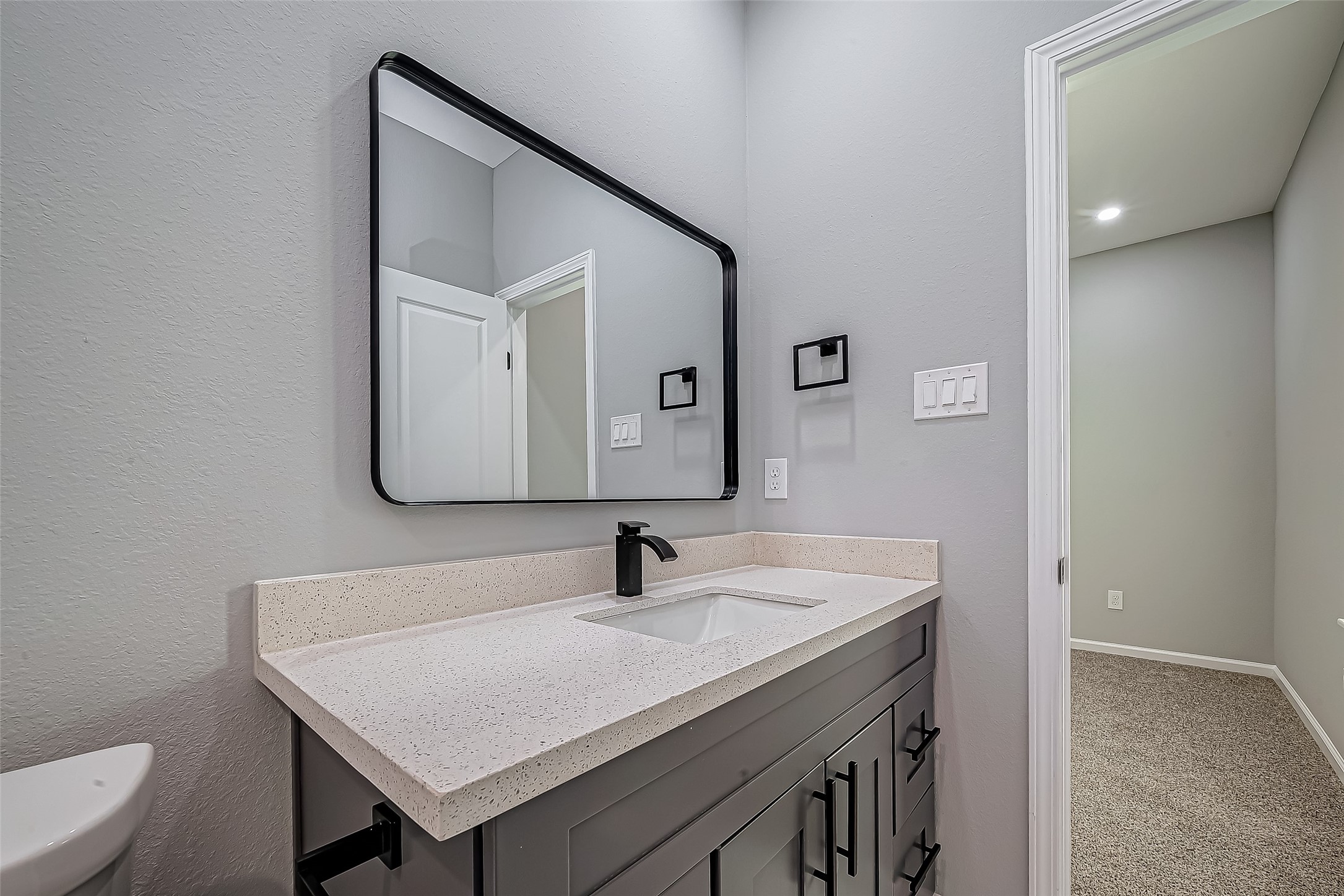7234 St Augustine Street, Unit A Houston, TX 77021 - Photo 18 of 20 a bathroom with a sink a toilet and mirror