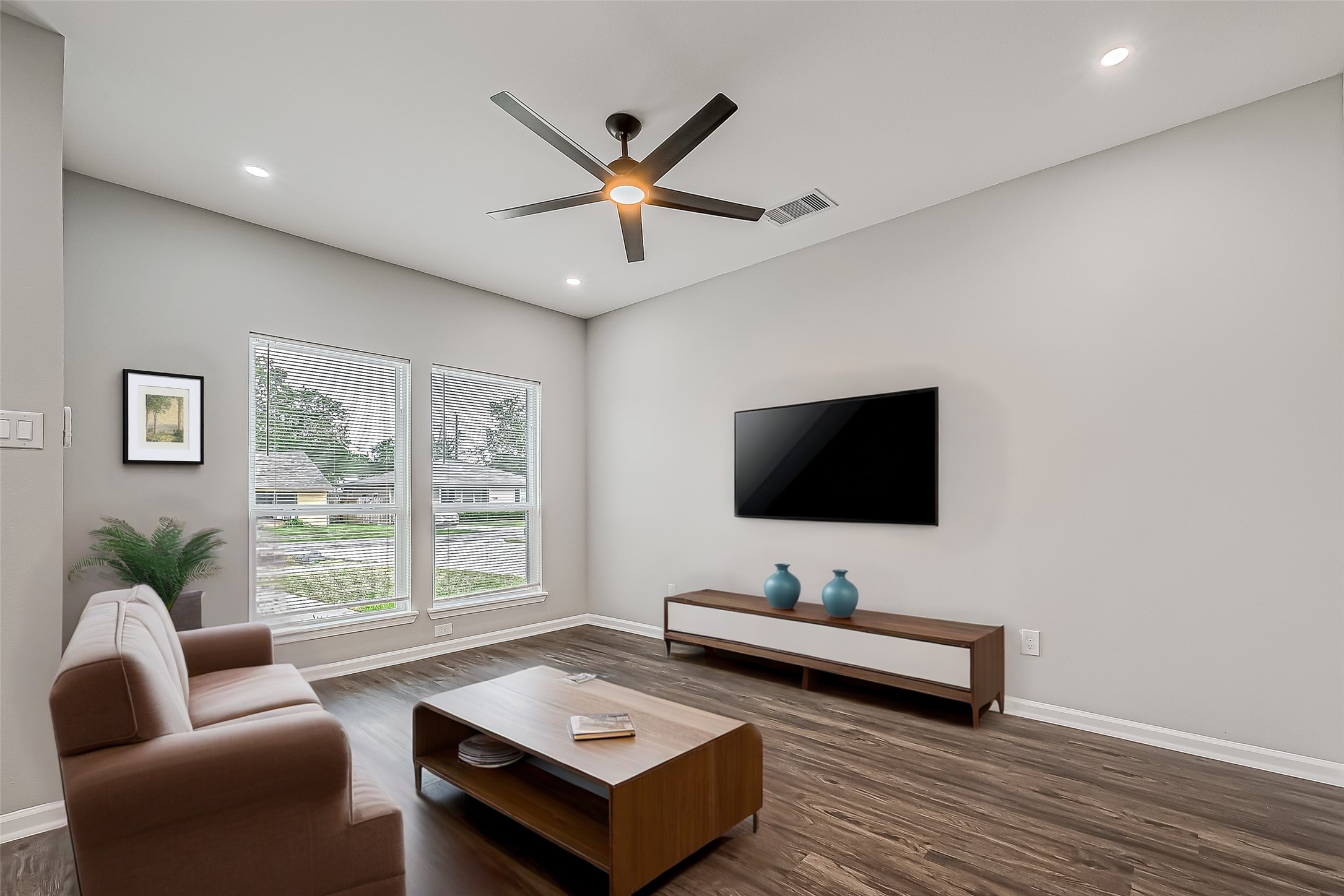 7234 St Augustine Street, Unit A Houston, TX 77021 - Photo 3 of 20 a living room with furniture and a flat screen tv
