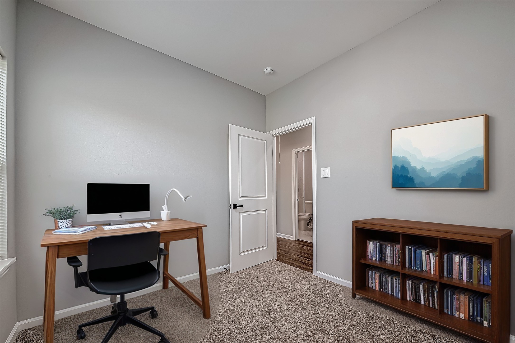 7234 St Augustine Street, Unit A Houston, TX 77021 - Photo 8 of 20 a view of a workspace with a bookshelf