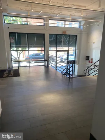 a view of a hallway with a window