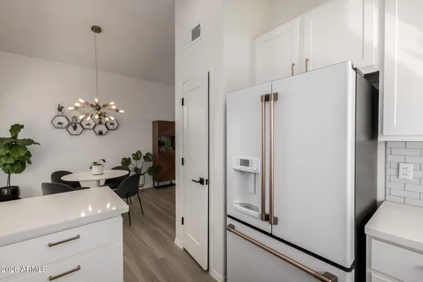 a view of kitchen with sink and dining table