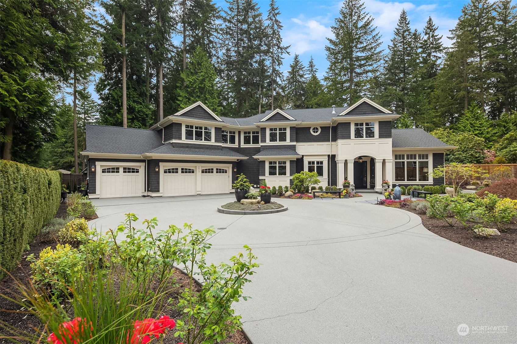 9013 Northeast 190th Street Bothell, WA 98011 - Photo 1 of 39 a front view of a house with a yard and fountain