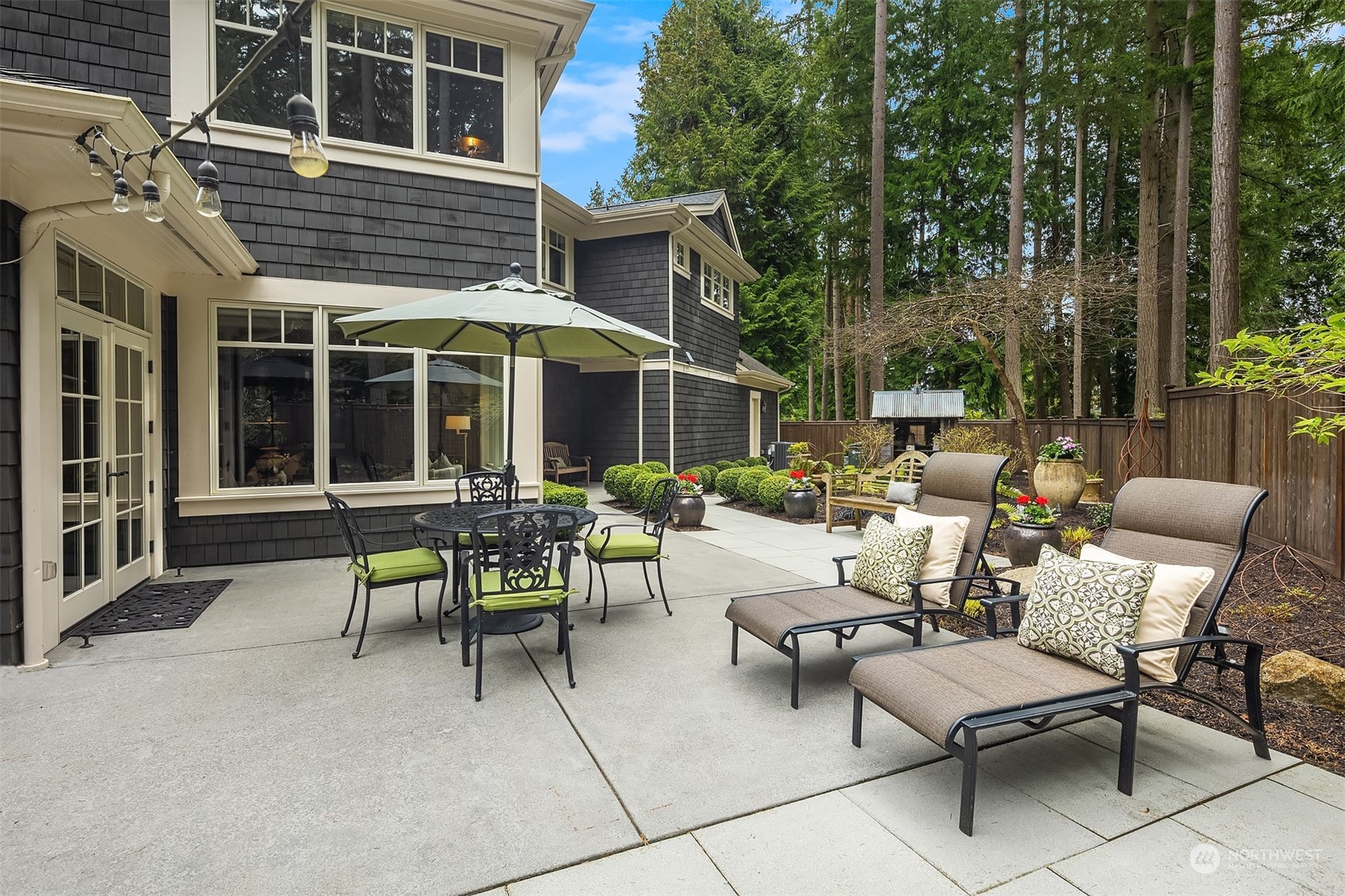 9013 Northeast 190th Street Bothell, WA 98011 - Photo 14 of 39 a view of a patio with a table and chairs and floor