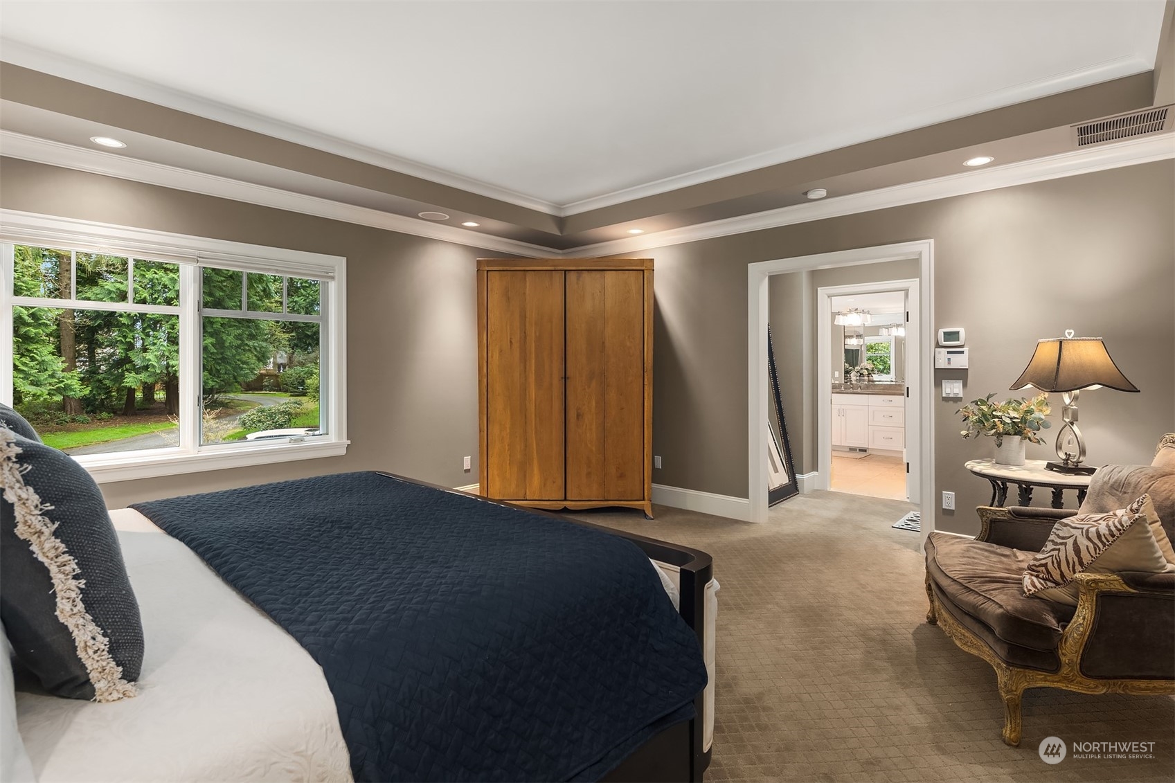 9013 Northeast 190th Street Bothell, WA 98011 - Photo 21 of 39 a bedroom with a bed and large windows