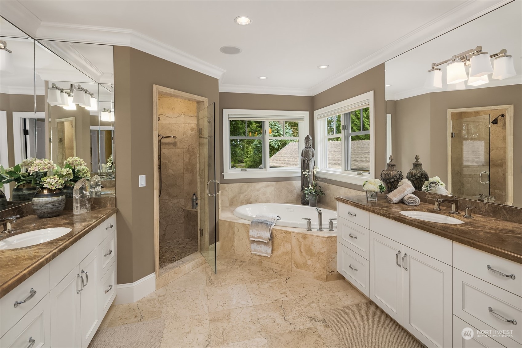 9013 Northeast 190th Street Bothell, WA 98011 - Photo 23 of 39 a spacious bathroom with a double vanity sink a large mirror a bathtub and next to a window